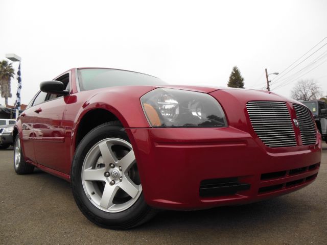 2005 DODGE MAGNUM SXT red we also have a v8 rt in stock with 22 rims  4 door 2 wheel drive